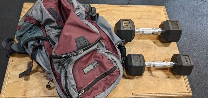 A backpack and two dumbbells