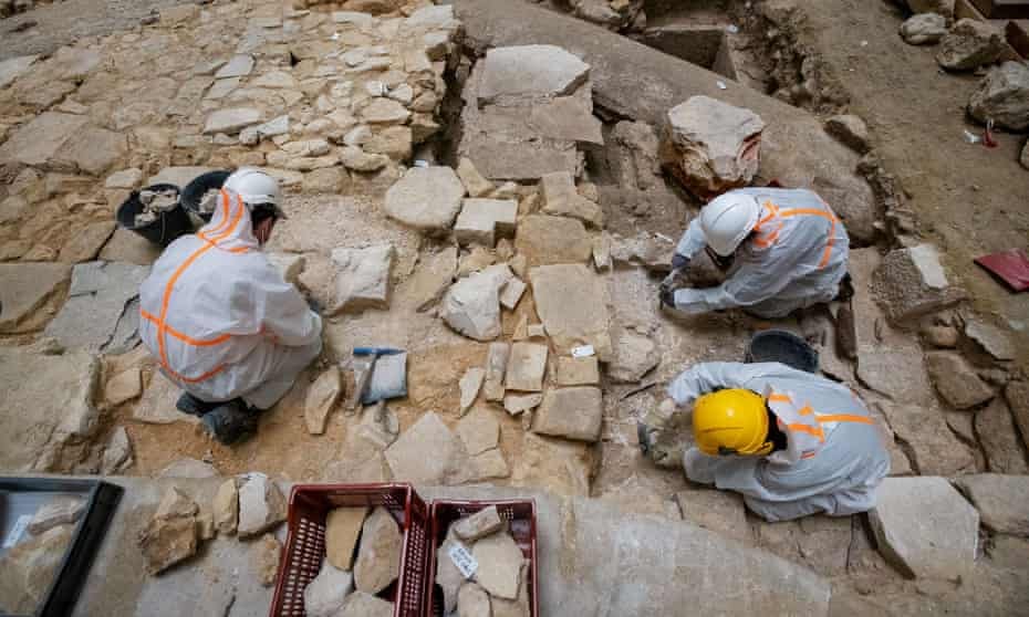 Archaeologists work at Notre Dame Cathedral