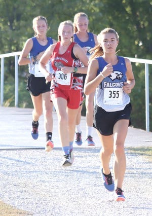 West Franklin’s Hope Crabtree leads her pack of runners on a way to a third-place finish. Mackenzie Walter (left) and Katie Cameron (right) look to make a move during the race. West Franklin’s Hope Crabtree leads her pack of runners on a way to a third-place finish. Mackenzie Walter (left) and Katie Cameron (right) look to make a move during the race.
