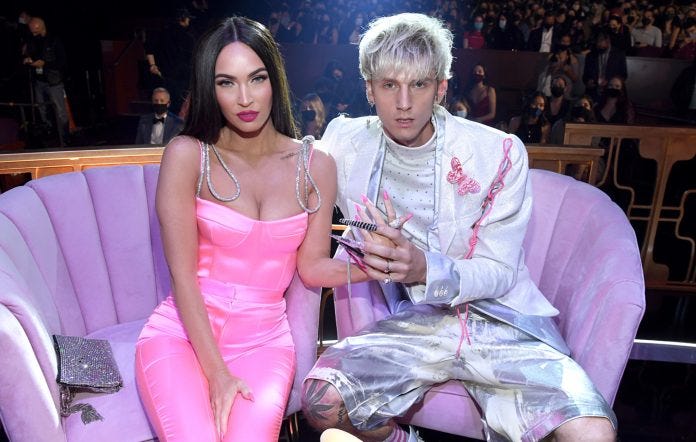 Megan Fox and Machine Gun Kelly pose for a photograph in 2021