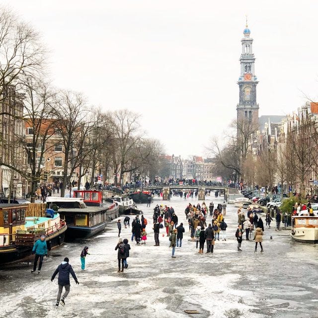 Snow and frozen canals in Amsterdam - Winter 2021 | Velvet Escape