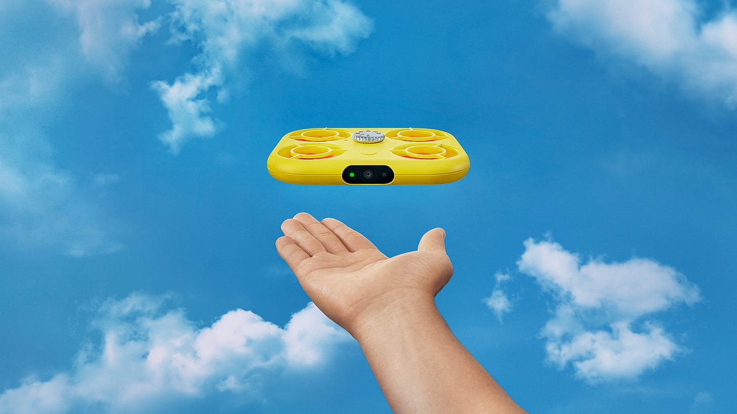 A photo of the Pixy drone floating over a hand against a blue sky. (Snap)