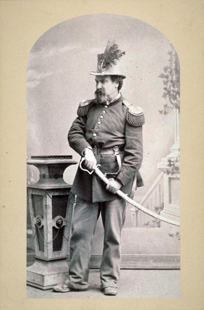 Emperor Norton in full dress uniform and military regalia, his hand on the hilt of a ceremonial sabre.