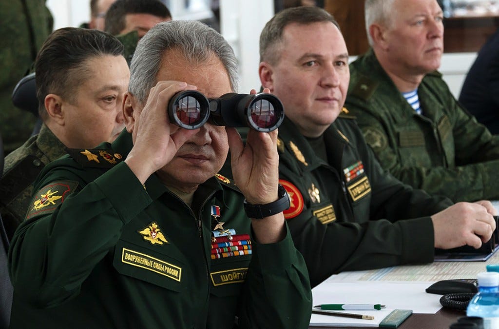 Defense Minister of Russia, Sergei Shoigu, left, inspects the troops of Russia and Belarus on Feb. 3.