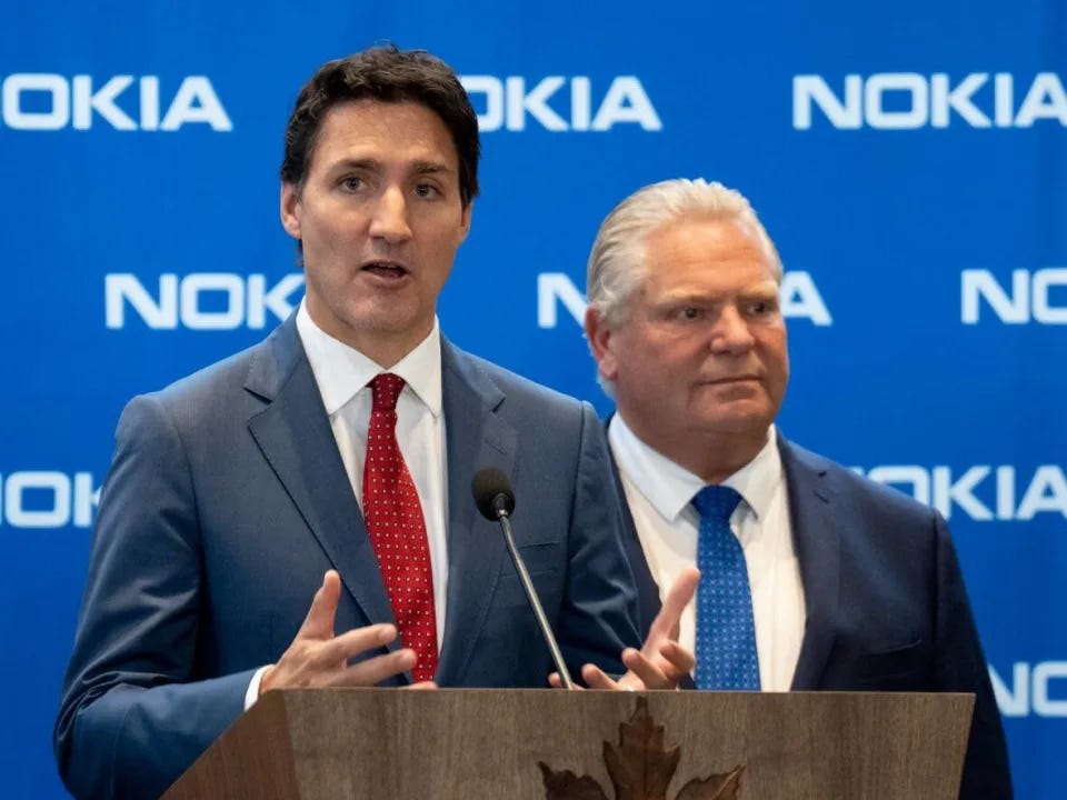 Prime Minister Justin Trudeau, seen here with Ontario Premier Doug Ford at a press event on Oct. 17, 2022, is encouraging Canadians to get vaccinated to 