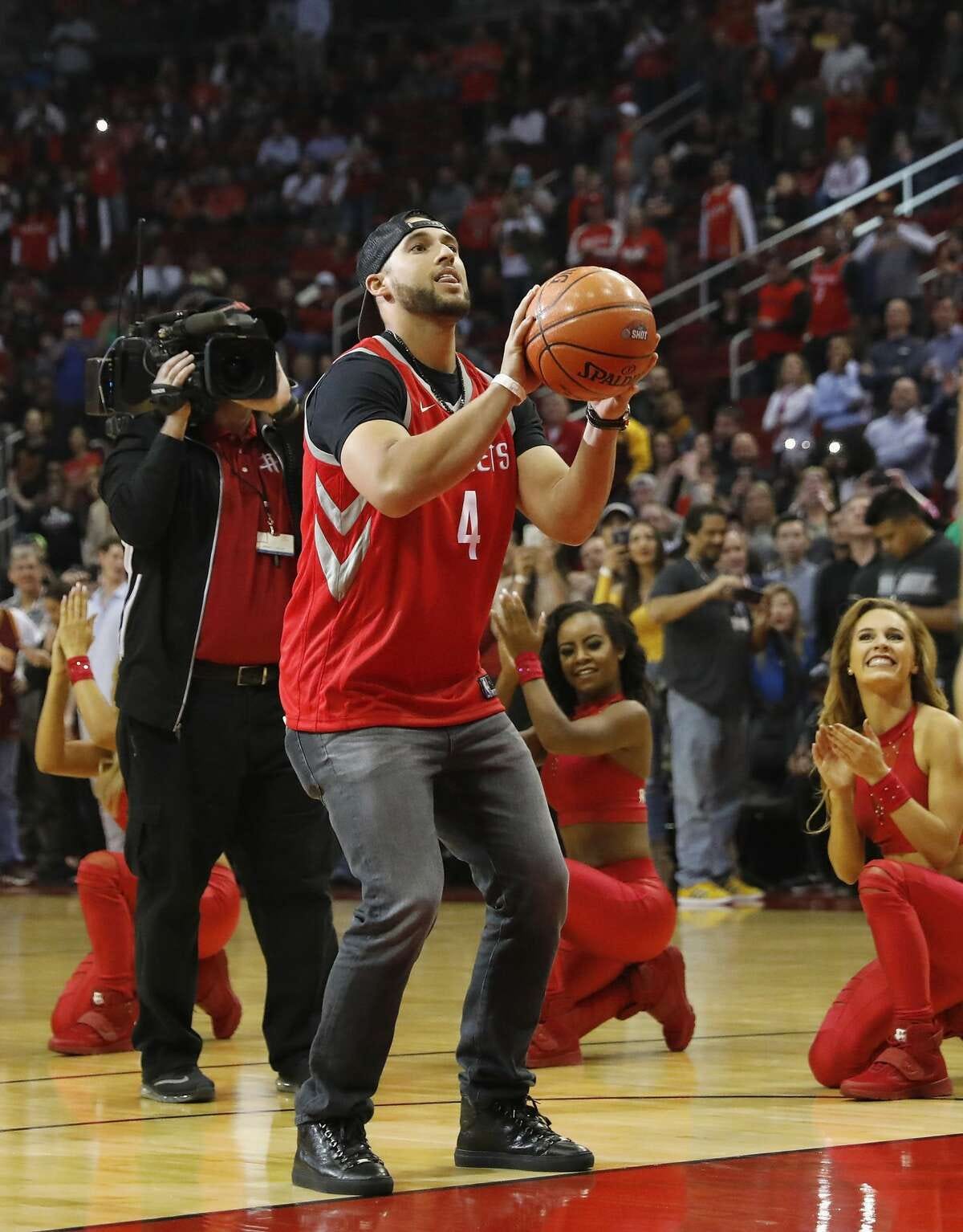 HOUSTON, TX - NOVEMBER 09: George Springer #4 of the Houston Astros shoots a free throw before the game between the Houston Rockets and the Cleveland Cavaliers at Toyota Center on November 09, 2017 in Houston, Texas. NOTE TO USER: User expressly acknowledges and agrees that, by downloading and or using this photograph, User is consenting to the terms and conditions of the Getty Images License Agreement. (Photo by Tim Warner/Getty Images)