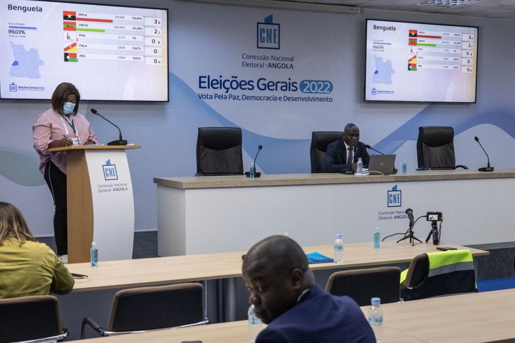 Officials from Angola’s National Electoral Commission briefing reporters on provisional election results in Luanda on Thursday (JOHN WESSELS/AFP via Getty Images)