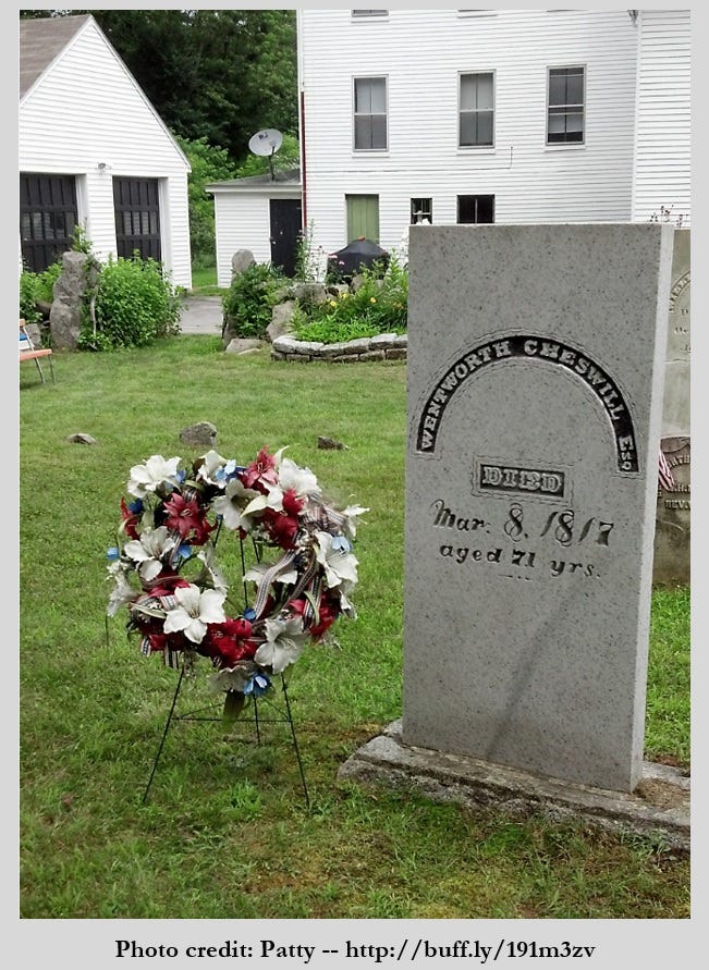 Wentworth Cheswell's grave stone with a wreath of flowers nearby.