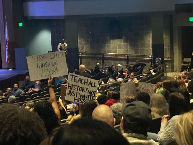 Some at the Temecula school board meeting held signs Tuesday, Dec. 13, 2022, as a proposal to ban critical race theory in the Temecula Valley Unified School District was discussed. (Photo by Allyson Vergara, The Press-Enterprise/SCNG)