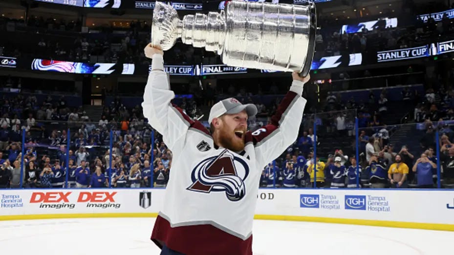 TAMPA, FLORIDA - JUNE 26: Gabriel Landeskog #92 of the Colorado Avalanche lifts the Stanley Cup after defeating the Tampa Bay Lightning 2-1 in Game Six of the 2022 NHL Stanley Cup Final at Amalie Arena on June 26, 2022 in Tampa, Florida. (Photo by Bruce Bennett/Getty Images)