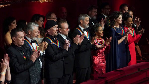 Kennedy Center honorees U2 (Larry Mullen Jr., Adam Clayton, The Edge, and Bono), George Clooney, Tania León, Amy Grant, and Gladys Knight.
