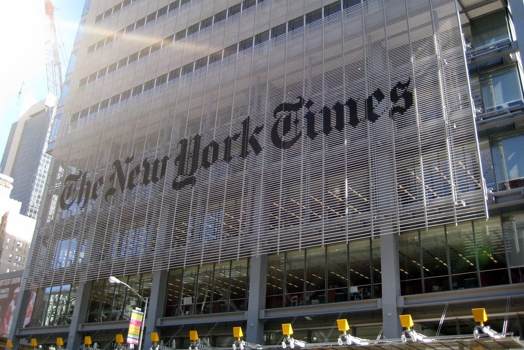 Exterior shot of the New York Times building in the sun.