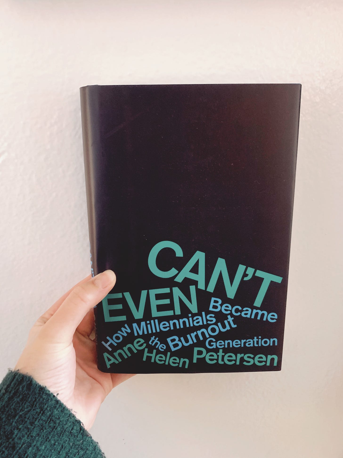 Dark blue hardback book against a white wall. Title of book reads, "Can't Even: How Millennials Became the Burnout Generation" by Anne Helen Petersen