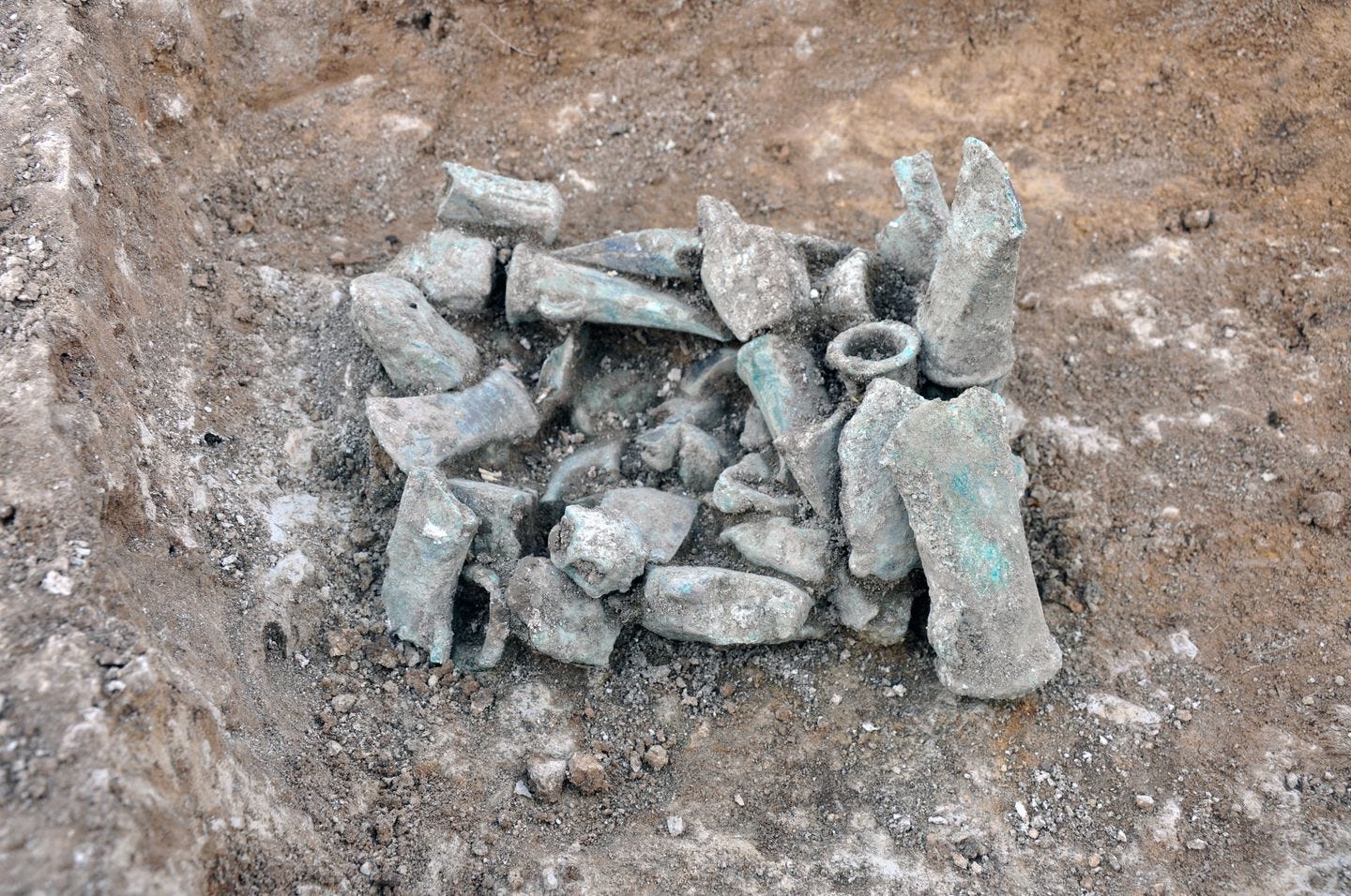 A photo provided by Oxford Archaeology East showed items from one of two Bronze Age hoards, totaling around 200 artifacts, that were found near Royston, England.