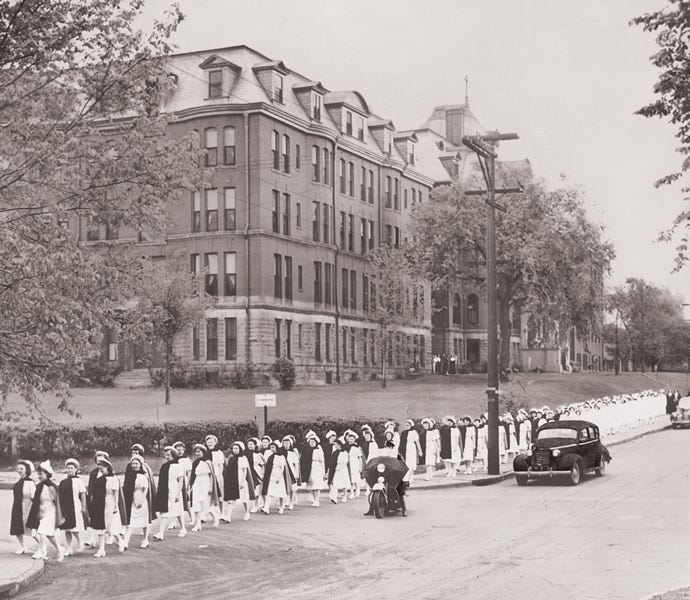 Mercy School of Nursing students walk to graduation in 1946