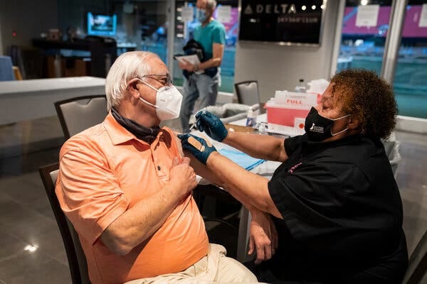 George Mattingly receiving the Pfizer vaccine for Covid-19 on Thursday in Atlanta.