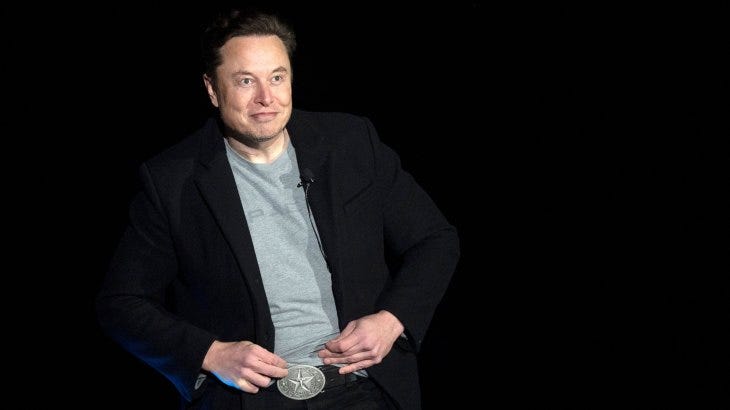 Elon Musk with Texas belt buckle