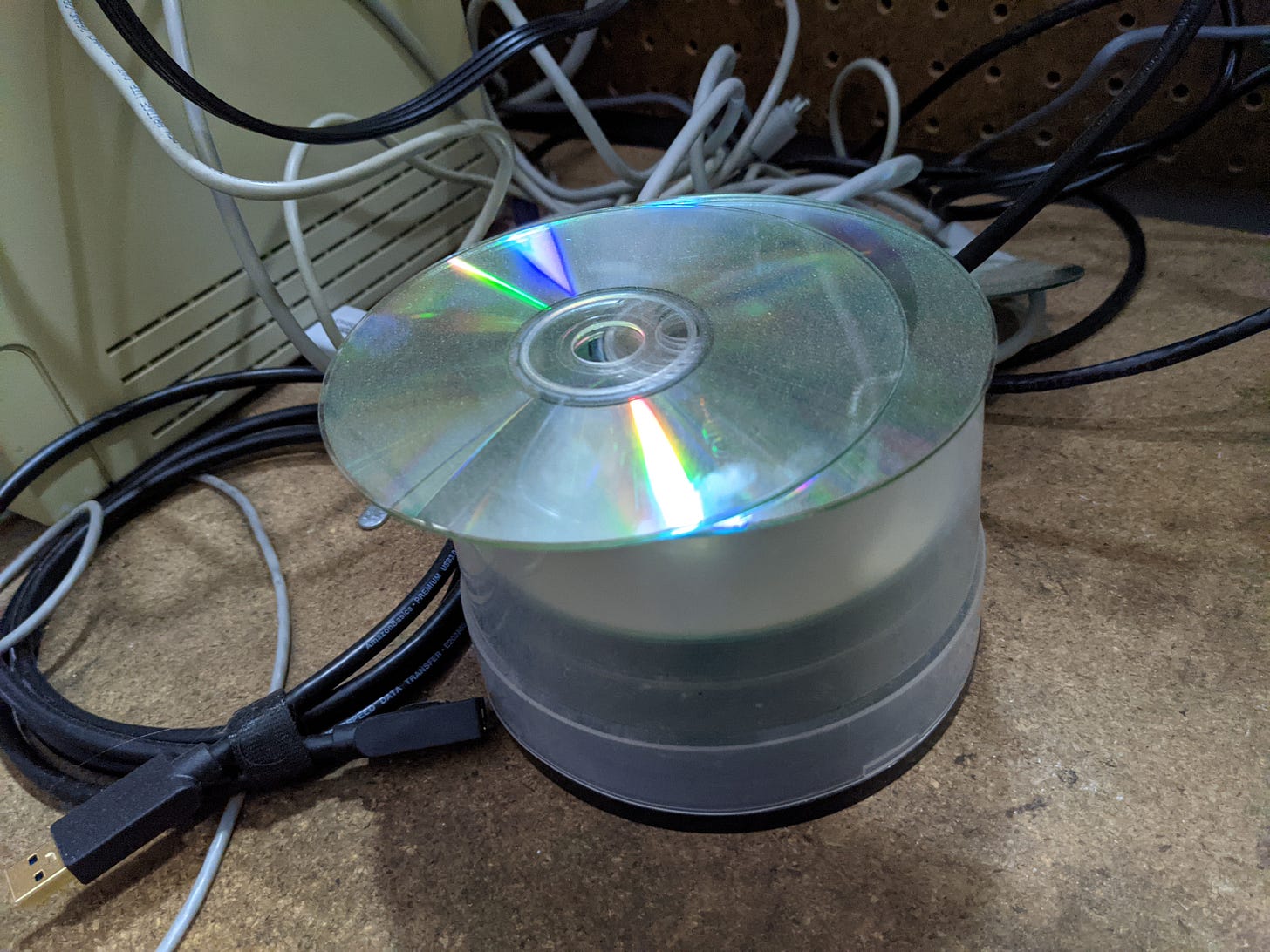 A stack of CD-ROMs on a desk. A stack of CD-ROMs on a desk.