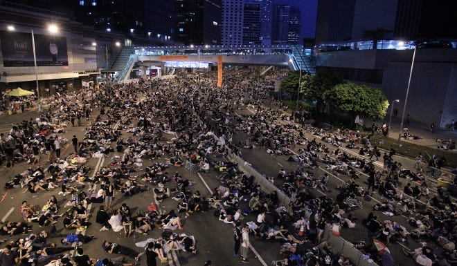 Tens of thousands of people in Hong Kong protested China’s strict restrictions on how the city could elect its leader in what would have been its first ever direct leadership election.