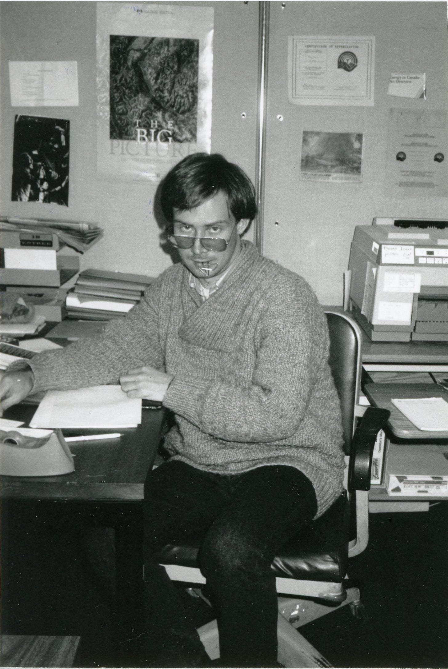 Photo of Michael Bryson in cubicle, Ottawa 1989