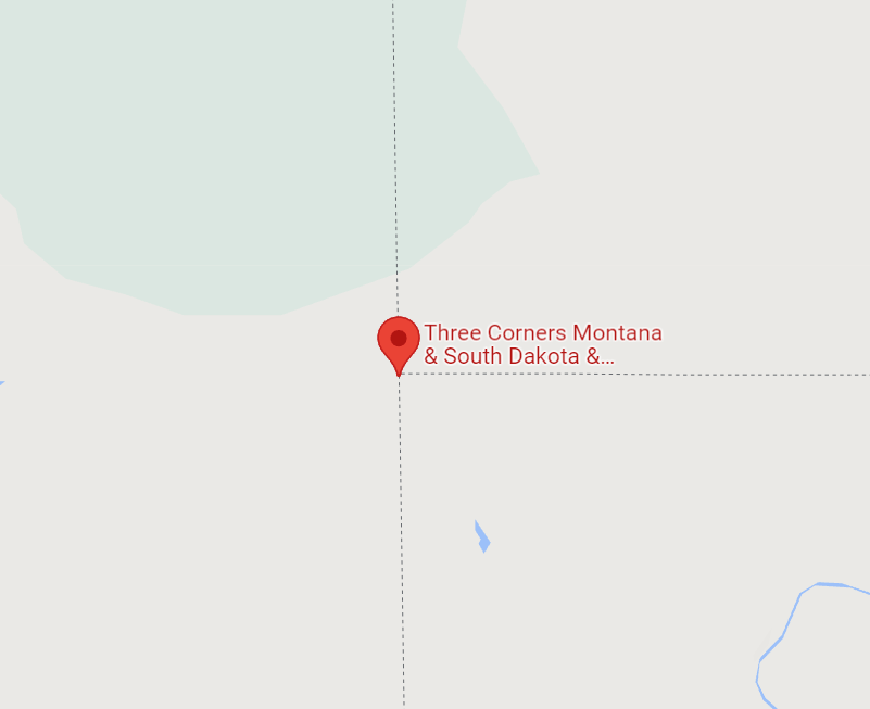 The Montana-South Dakota-North Dakota tripoint on Google Maps. It's on land.