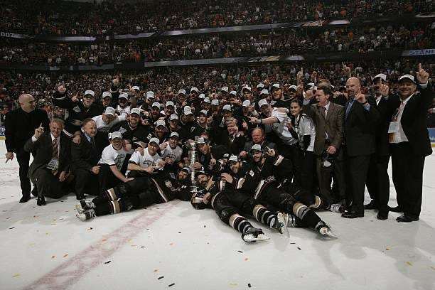 Hockey: NHL Finals, Team portrait of Anaheim Ducks victorious with Stanley Cup trophy during celebration after winning Game 5 and series vs Ottawa...