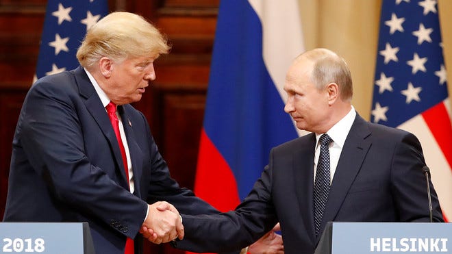 Trump and Putin shaking hands