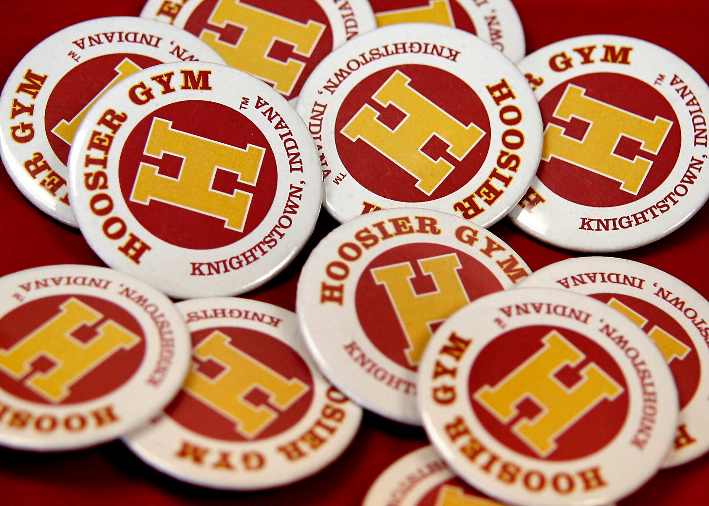 Hoosier Gym souvenirs are always on sale, and proceeds benefit the historic structure. T-shirts, DVD copies of the film, posters, pencils and other items can always be purchased on a visit to the gym. Among the favorites are buttons like these and Jimmy Chitwood T-shirts emblazoned with the words, “I’ll make it.”