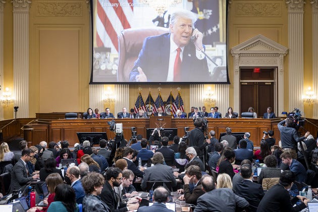 A video of former President Donald Trump is shown on a screen, as the House select committee investigating the Jan. 6 attack on the U.S. Capitol holds its final meeting on Capitol Hill.