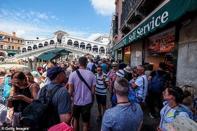 Visitor-only routes to popular landmarks were introduced to keep tourists away from the locals. The visitor-only routes were put in place for tourists heading to St Mark's Square and the Rialto Bridge (pictured)