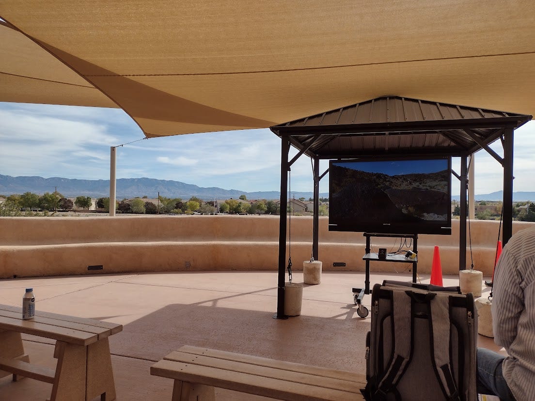 Outdoor large TV on patio with view of mountains
