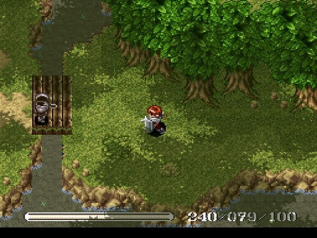 A screenshot of Adol running around a forest, about to battle a knight