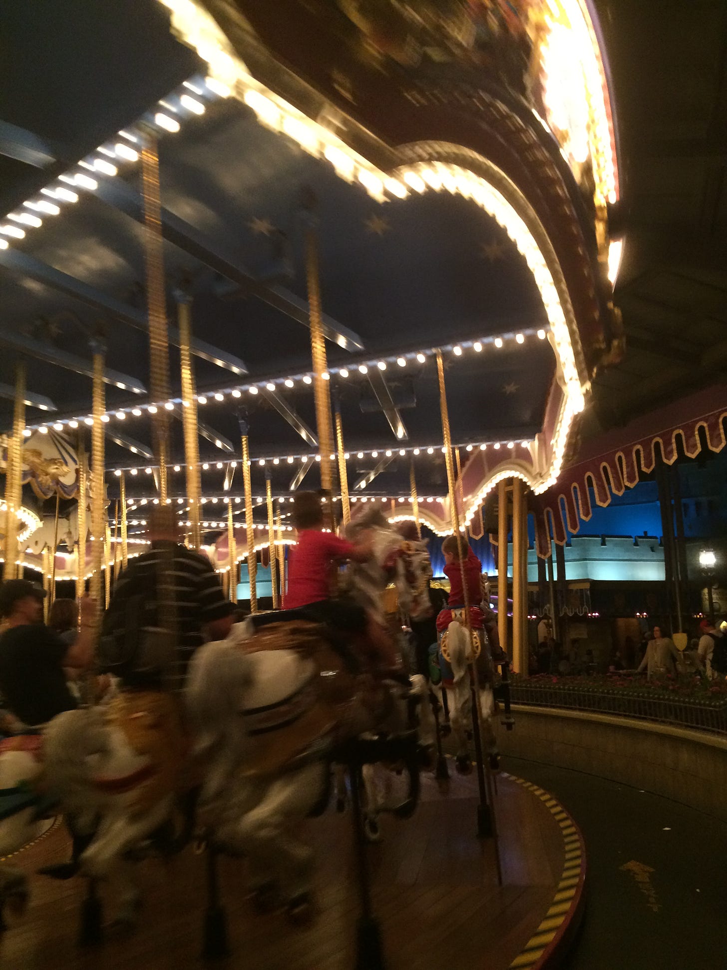 Merry-go-round in motion with blurred lights.