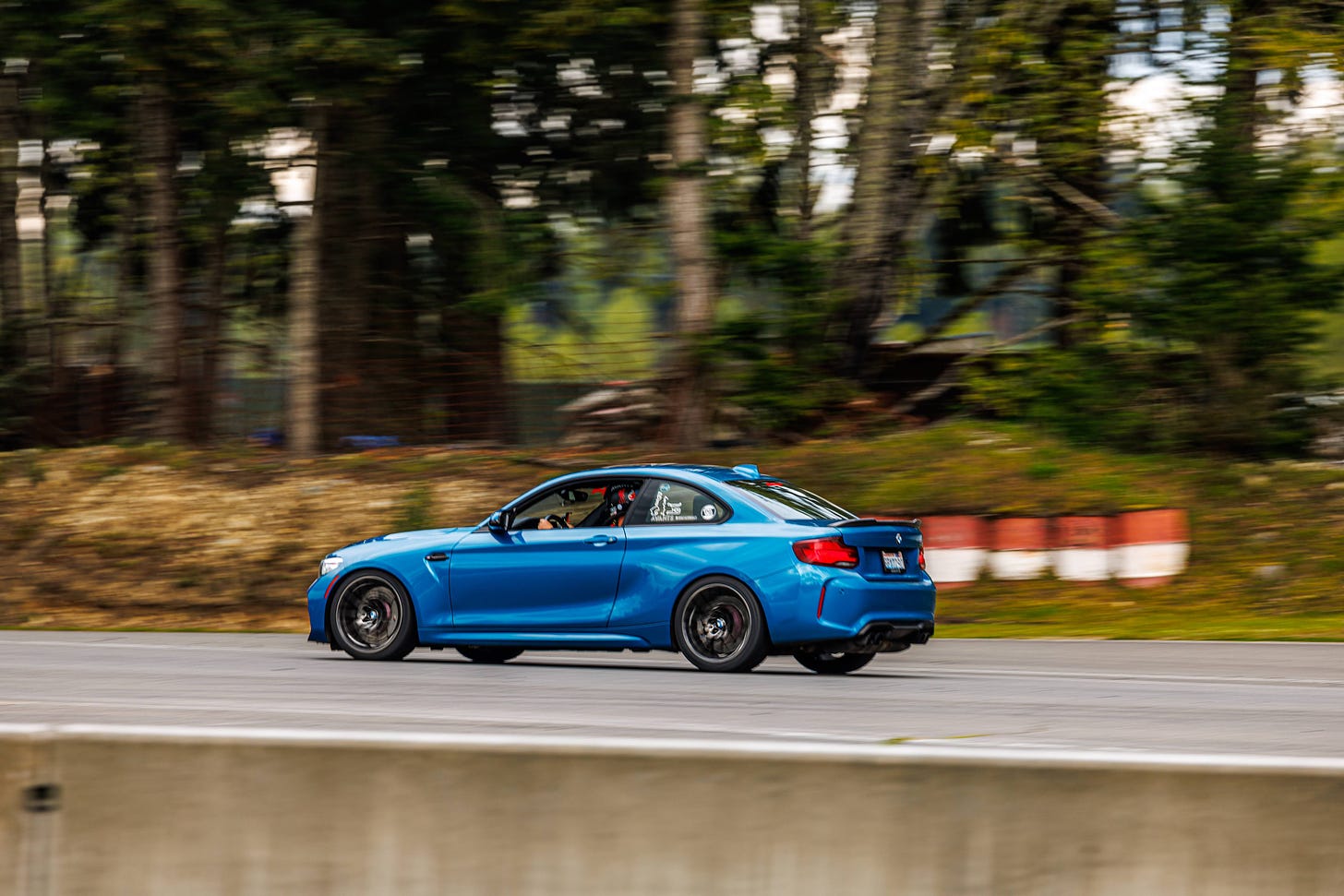Blue BMW M2 on race track