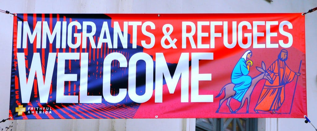 Immigrants & Refugees Welcome Sign
