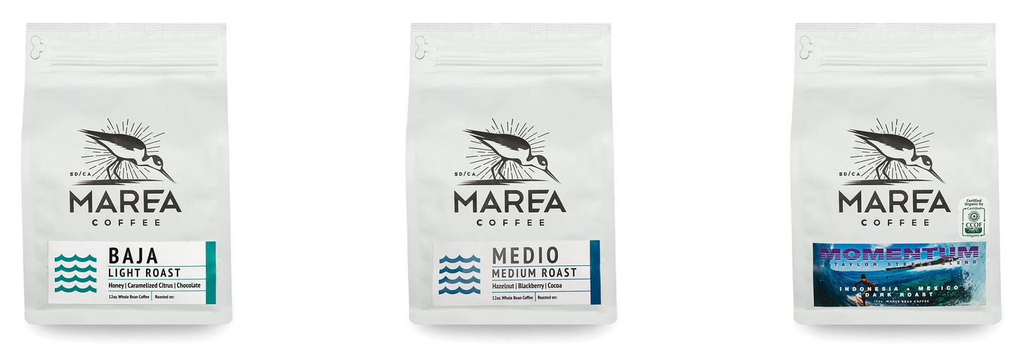 Three white bags of coffee from Marea Coffee on a white background.