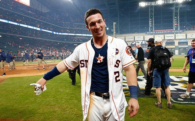 Alex Bregman #2 of the Houston Astros celebrates after hitting the game-winning single during the tenth inning to defeat the Los Angeles Dodgers in game five of the 2017 World Series at Minute Maid Park on October 30, 2017 in Houston, Texas. (Jamie Squire/Getty Images via JTA)