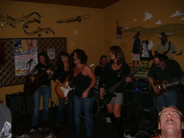 In this shot, Agent 99 had a guest vocalist. Skip Dixxon is helping out on drums, by the way. And I have no clue what the guy on the right is looking up at.