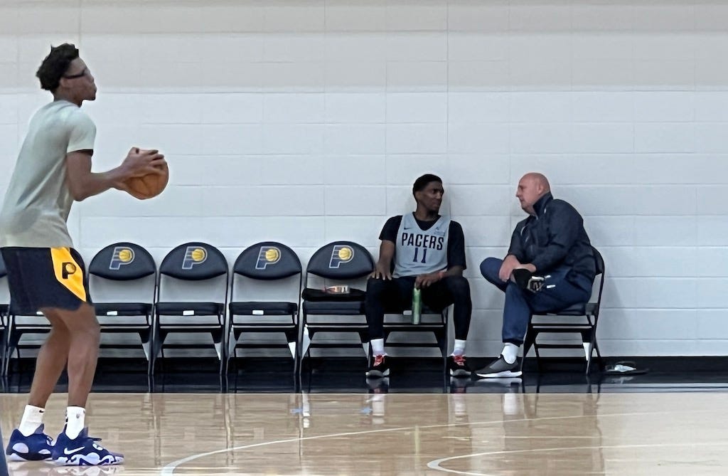 Langston Galloway talks with Jim Boylen after Pacers practice.