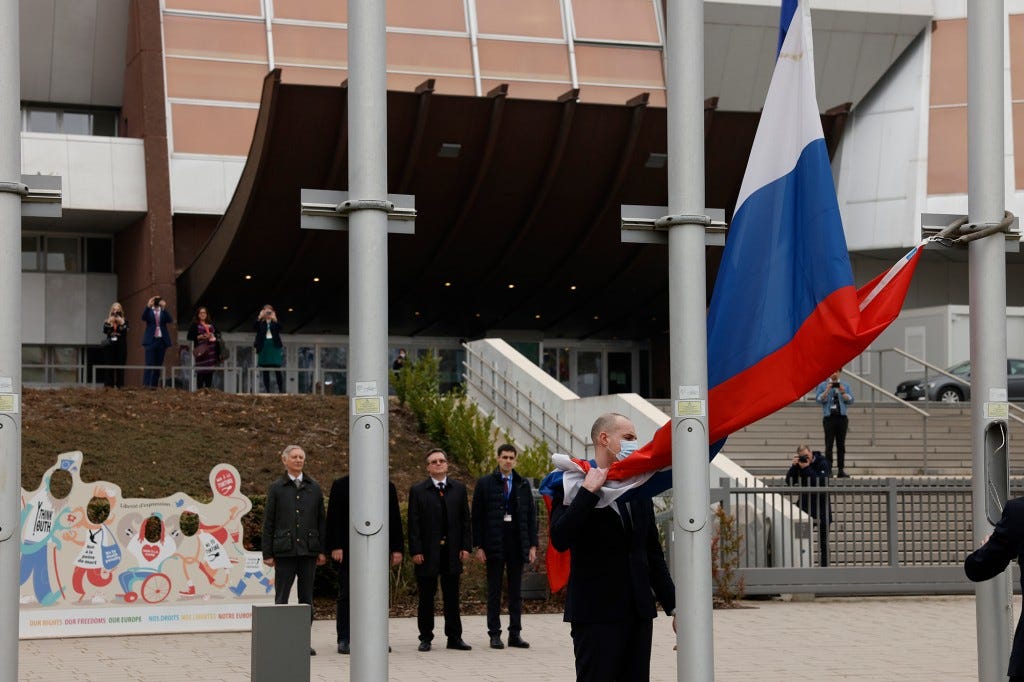 Employees of the Council of Europe remove the Russian flag from the Council of Europe building.