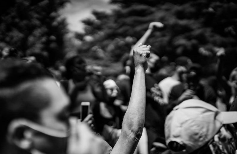 A raised fist at a protest