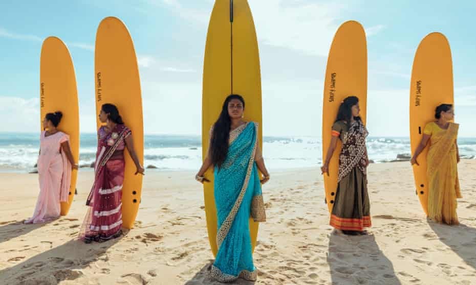Shamali Sanjaya (centre) with members of the Arugam Bay Girls Surf Club