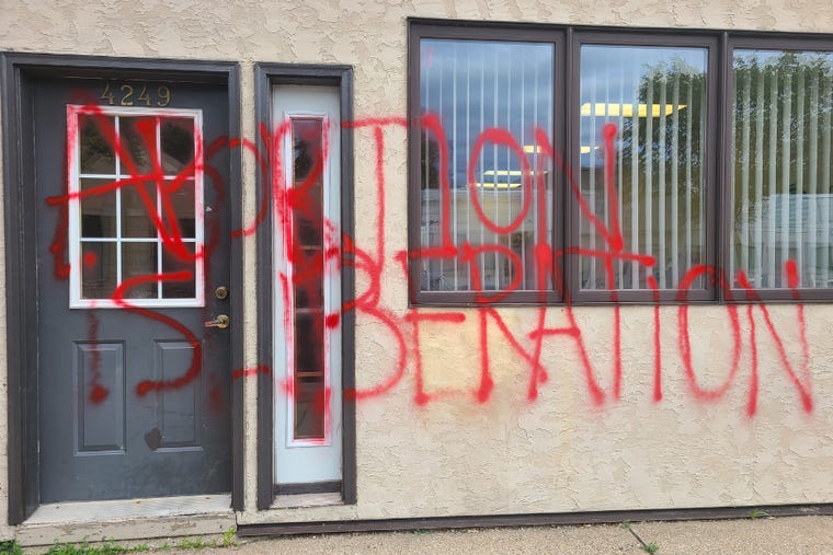'Abortion Is Liberation' written in red spray paint outside the offices of Minnesota Concerned Citizens for Life.  The attack was discovered the morning of Wednesday, June 15, 2022.