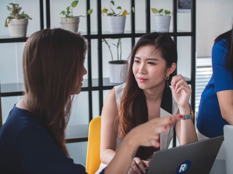 Two women sitting and talking