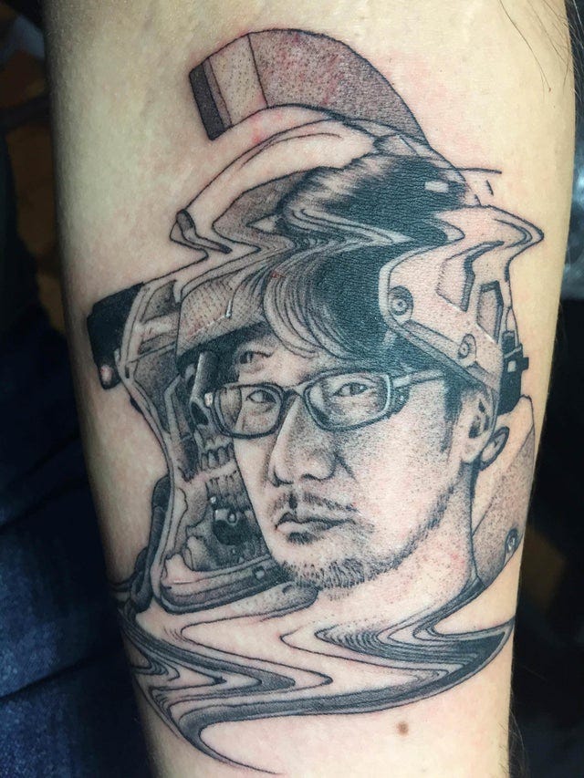 r/tattoos - My first tattoo: Hideo Kojima / Ludens glitched portrait done by Max Amos at Get Fat Brooklyn, in Brooklyn, NY. - Trippy, i like it.