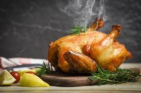 Premium Photo | Whole roasted chicken rosemary and tomato lemon on wooden  cutting board - baked chicken grilled barbecue delicious food on dining  table at holiday celebrate