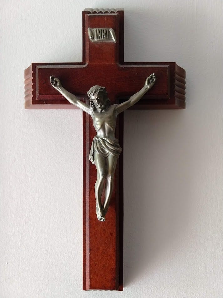 Wooden crucifix with silverish-metalwork Jesus and INRI.
