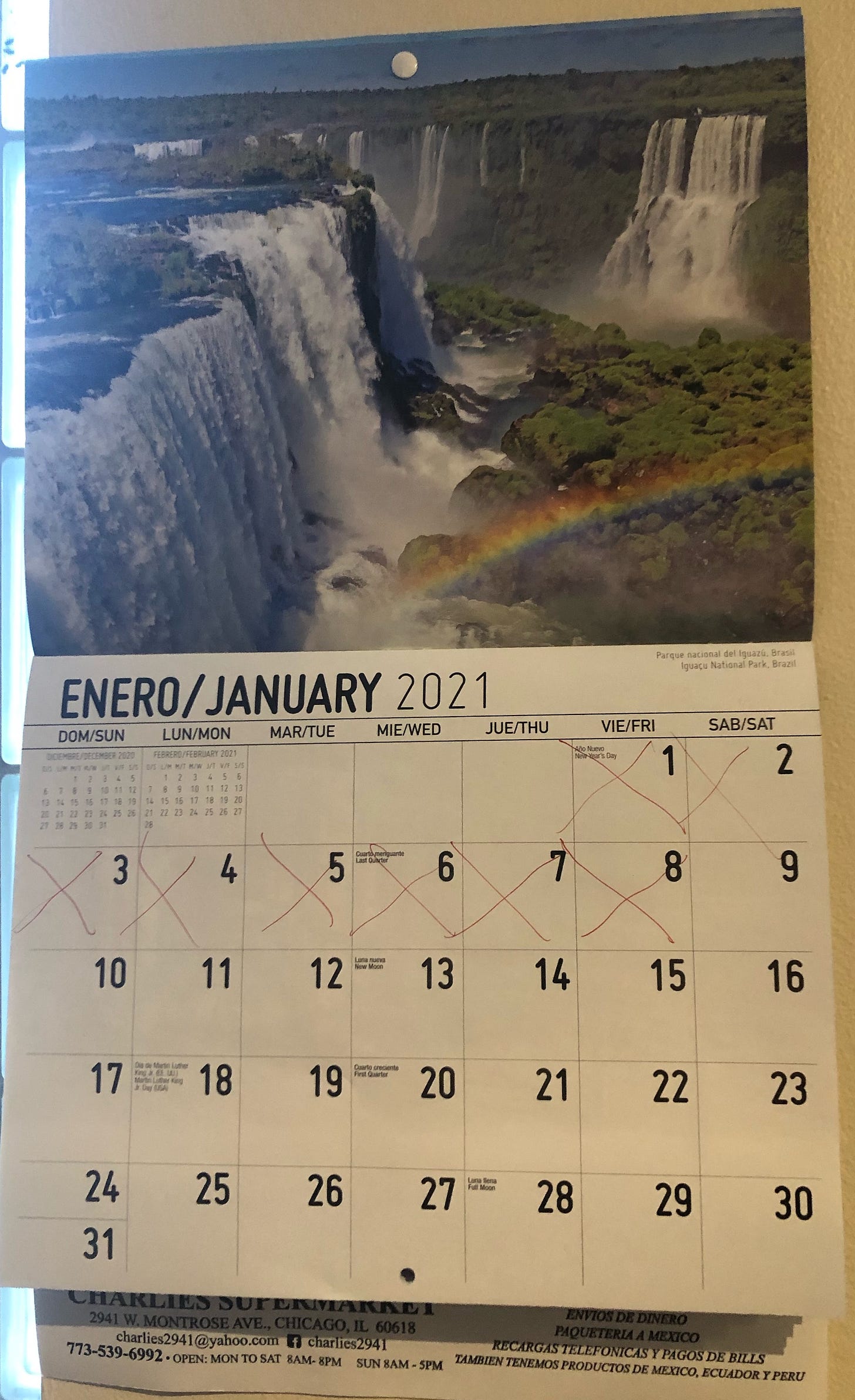 Wall calendar with red Xes marked on every day of January from the 1st to the 8th. Picture is a majestic Brazilian waterfall in Iguaçu National Park, Brazil