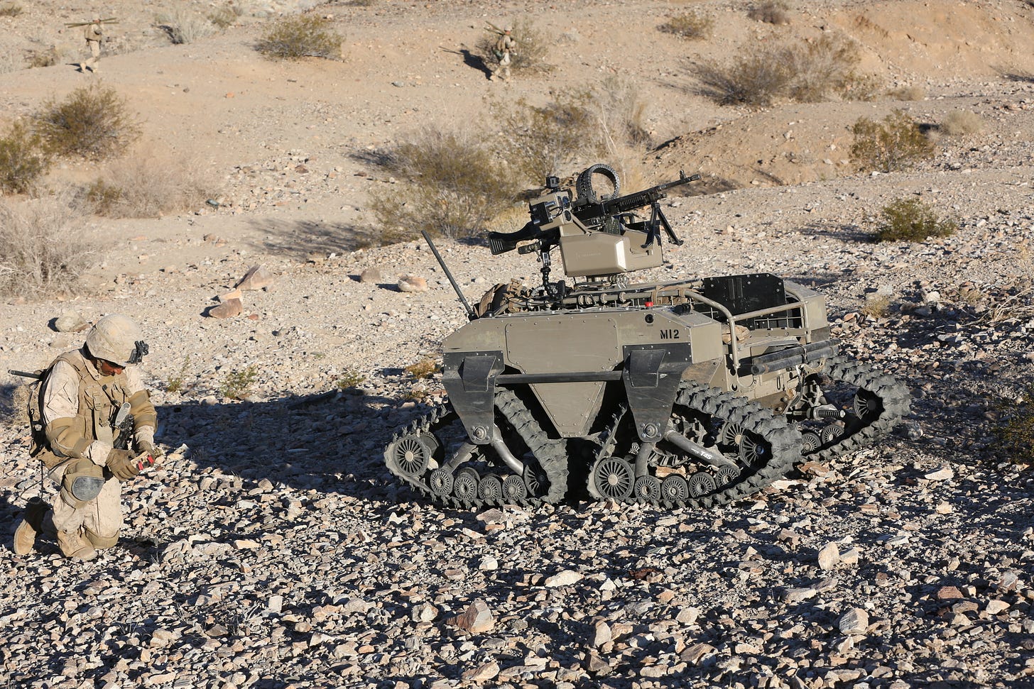 LCpl Jagseer Sindhu a machinegunner assigned to Lima Co, 3rd Battalion, 5th Marine Regiment prepares to engage targets with a Weaponized Multipurpose Unmanned Tactical Transport while participating in an Integrated Training Exercise at the Marine Corps Air-Ground Combat Center, Twentynine Palms, California. This is a training event within their predeployment training curriculum. The Marine Corps Warfighting Laboratory provided some different unmanned aircraft systems (UAS) and unmanned ground systems (UGS) for the Marines to employ during their training cycle. 