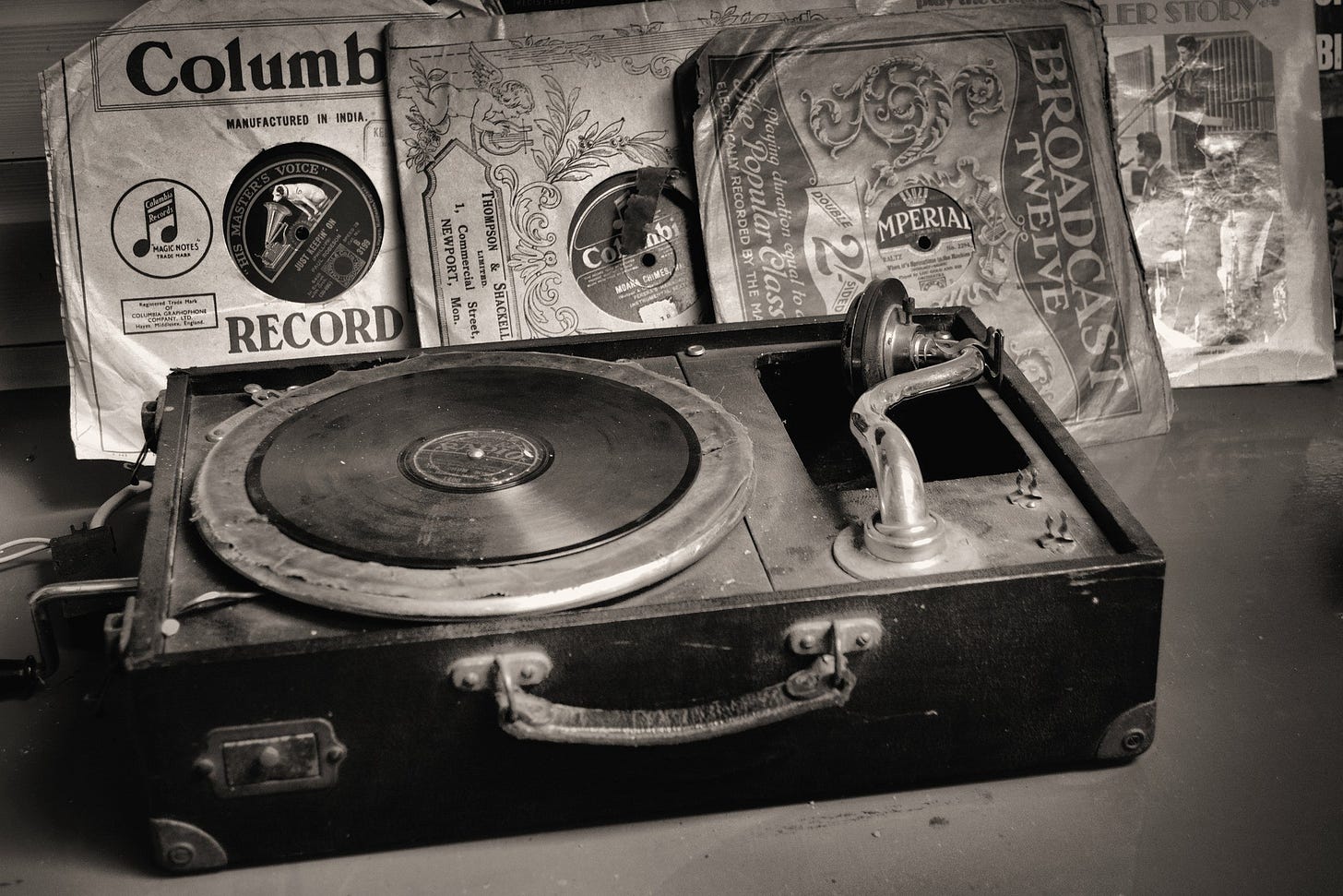 Old beat up record player with 45s in background. (Image: Anthony Scanlon via Pixabay)